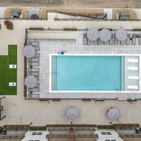 overview of a courtyard with a lawn and a pool