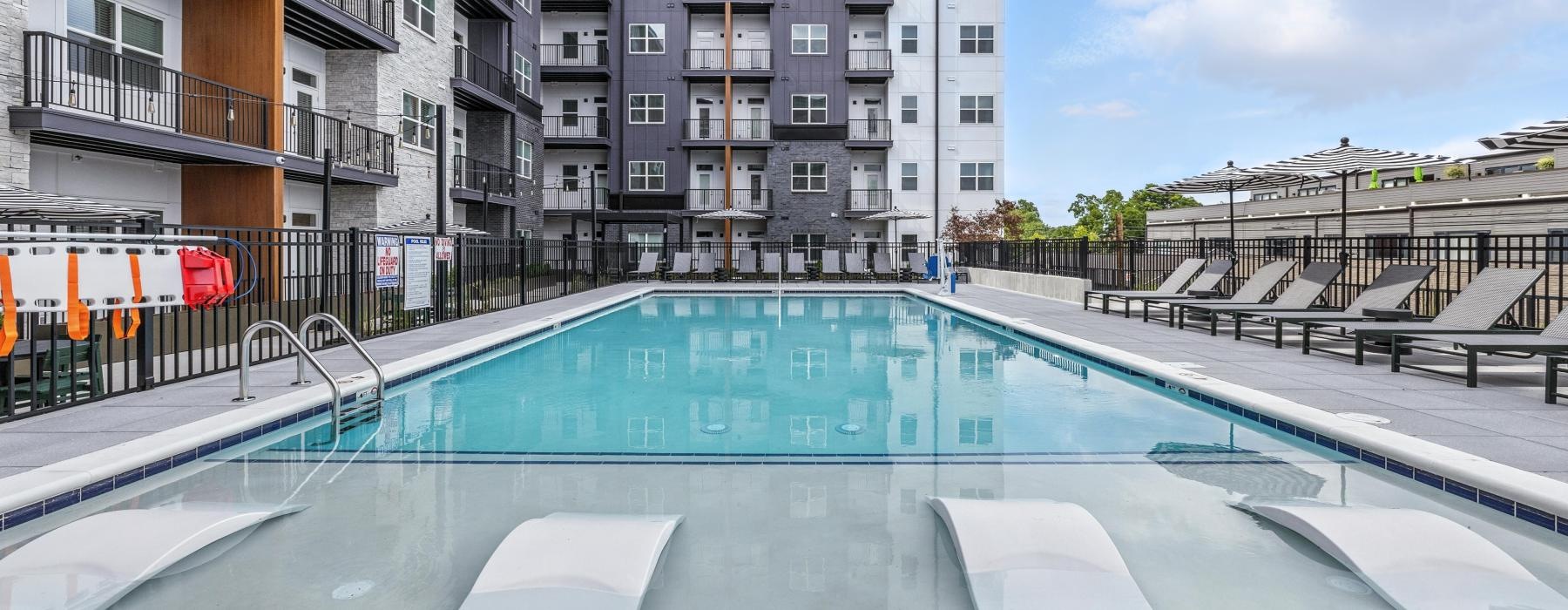 a swimming pool in front of a building