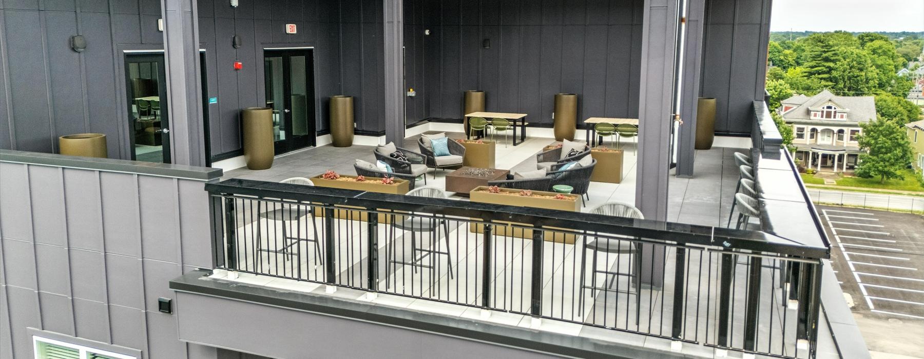 a patio with chairs and tables